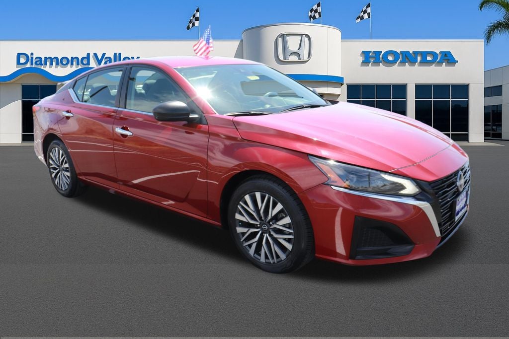 2024 Nissan Altima 2.5 SV in Scarlet Ember — front three-quarter view