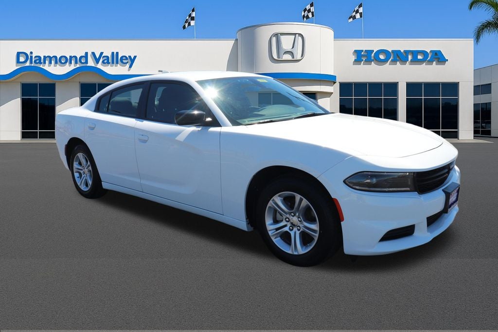 2023 Dodge Charger SXT in White Knuckle Clearcoat — front three-quarter view