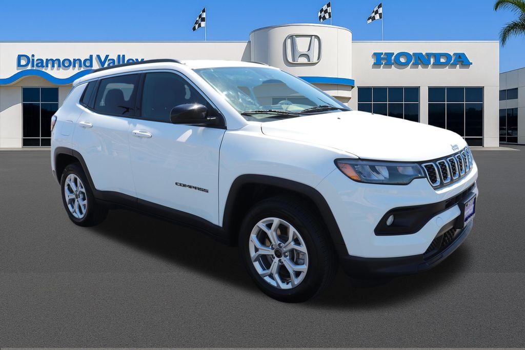 2025 Jeep Compass Latitude in Bright White Clearcoat — front three-quarter view