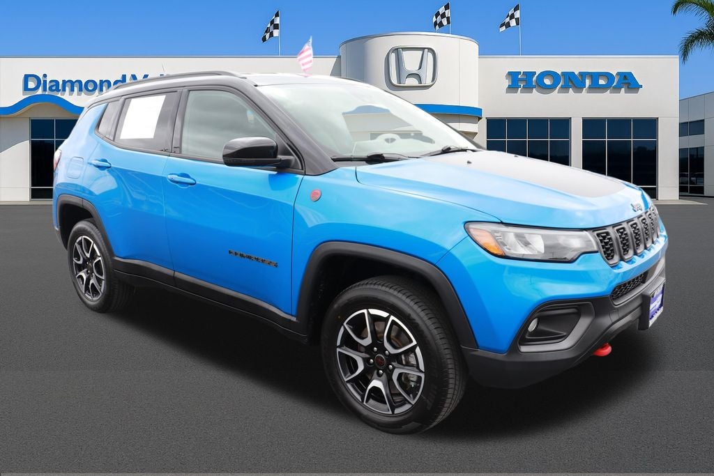 2025 Jeep Compass Trailhawk in Hydro Blue Pearlcoat — front three-quarter view