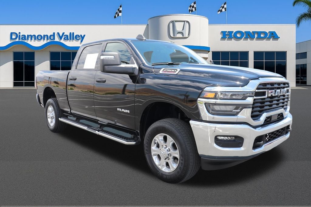 2025 RAM 2500 Big Horn in Diamond Black Crystal Pearlcoat — front three-quarter view