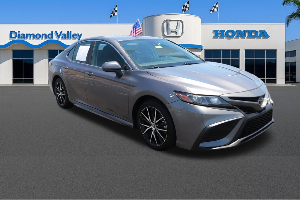 2021 Toyota Camry SE in Predawn Gray Mica — front three-quarter view