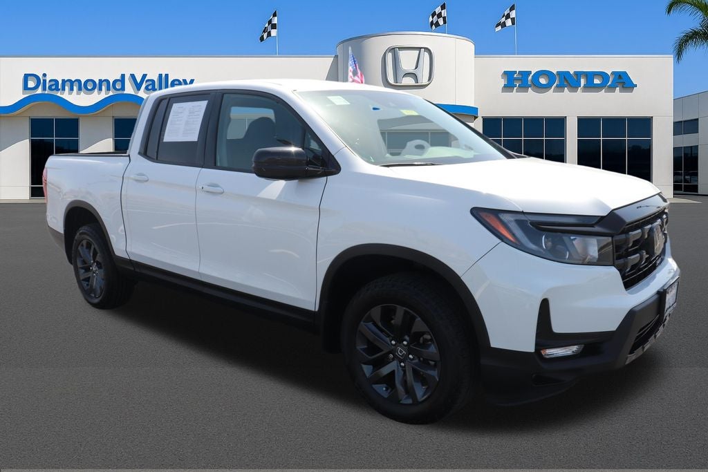2024 Honda Ridgeline Sport in Platinum White Pearl — front three-quarter view