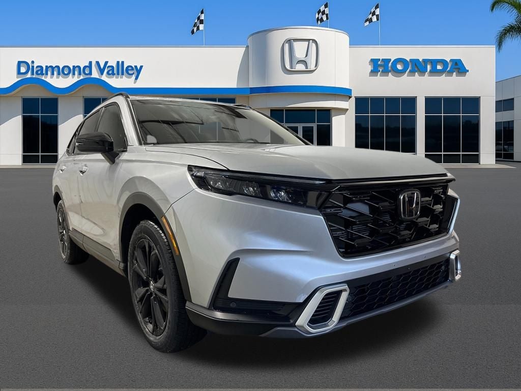 2026 Honda CR-V Hybrid Sport Touring in Solar Silver Metallic — front three-quarter view