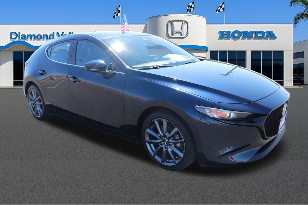 2020 Mazda Mazda3 Base in Deep Crystal Blue Mica — front three-quarter view