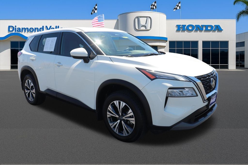 2023 Nissan Rogue SV in Pearl White Tricoat — front three-quarter view