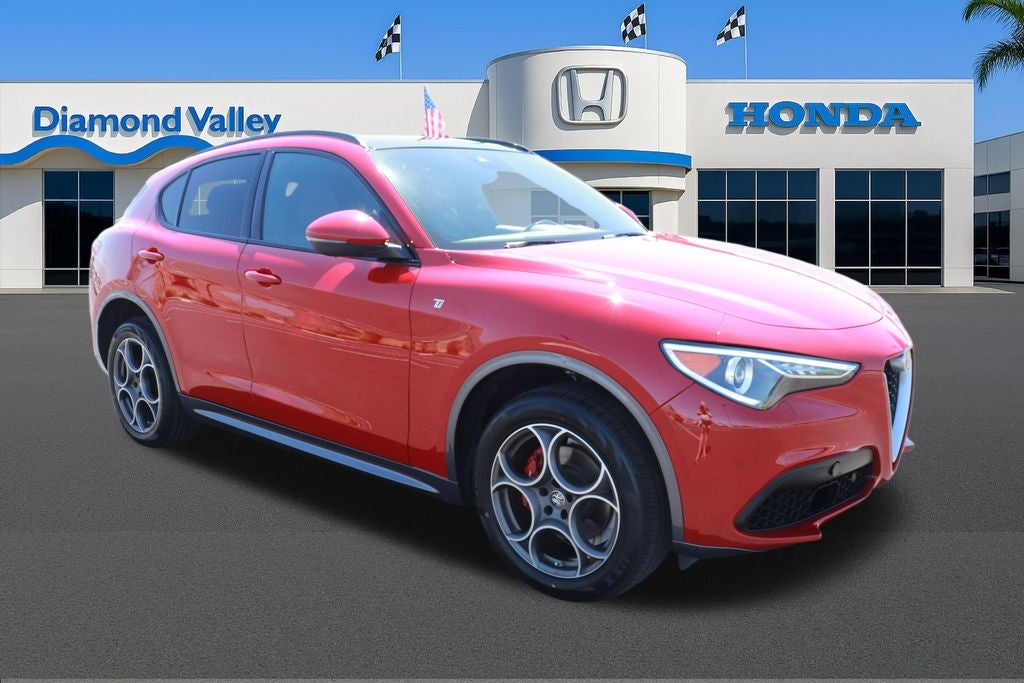 2023 Alfa Romeo Stelvio Ti AWD AWD in Alfa Rosso — front three-quarter view