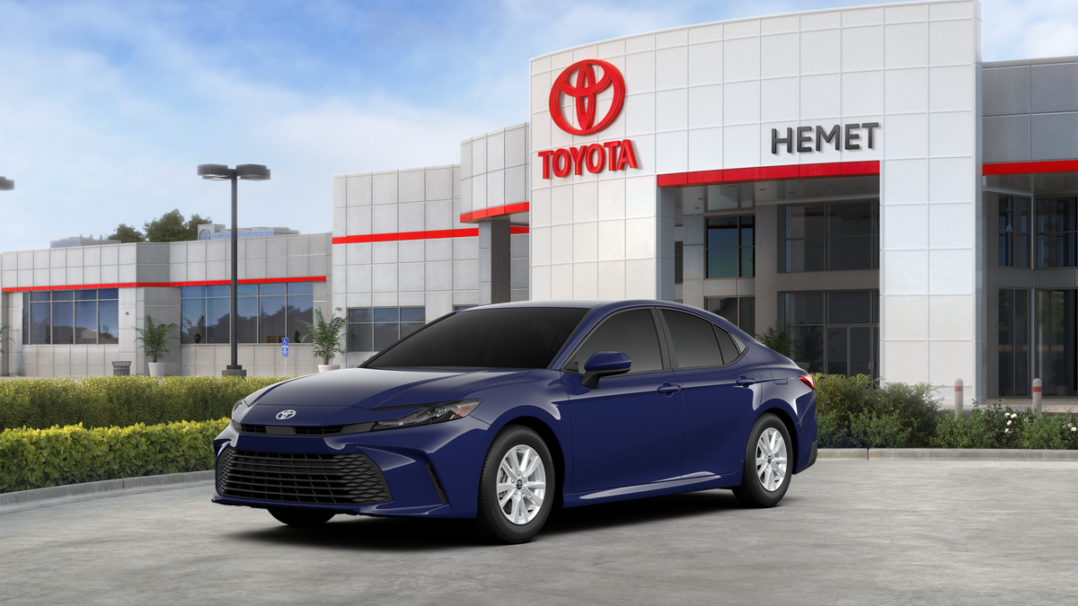 2026 Toyota Camry LE in Reservoir Blue — front three-quarter view
