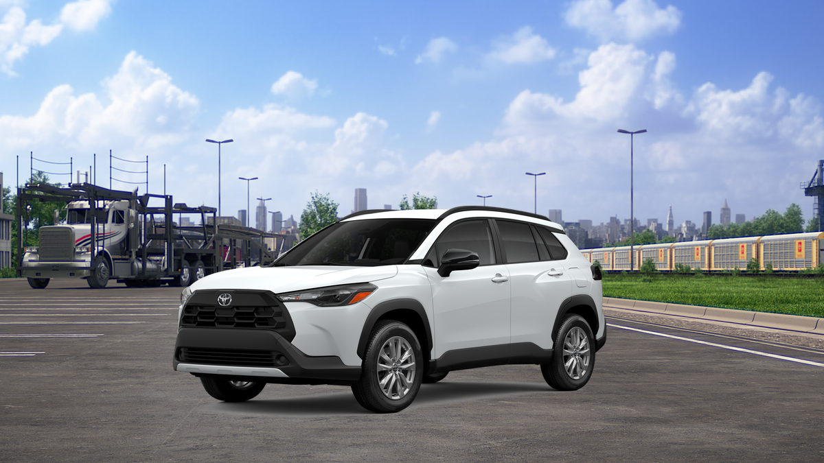 2026 Toyota Corolla Cross LE in Wind Chill Pearl — front three-quarter view