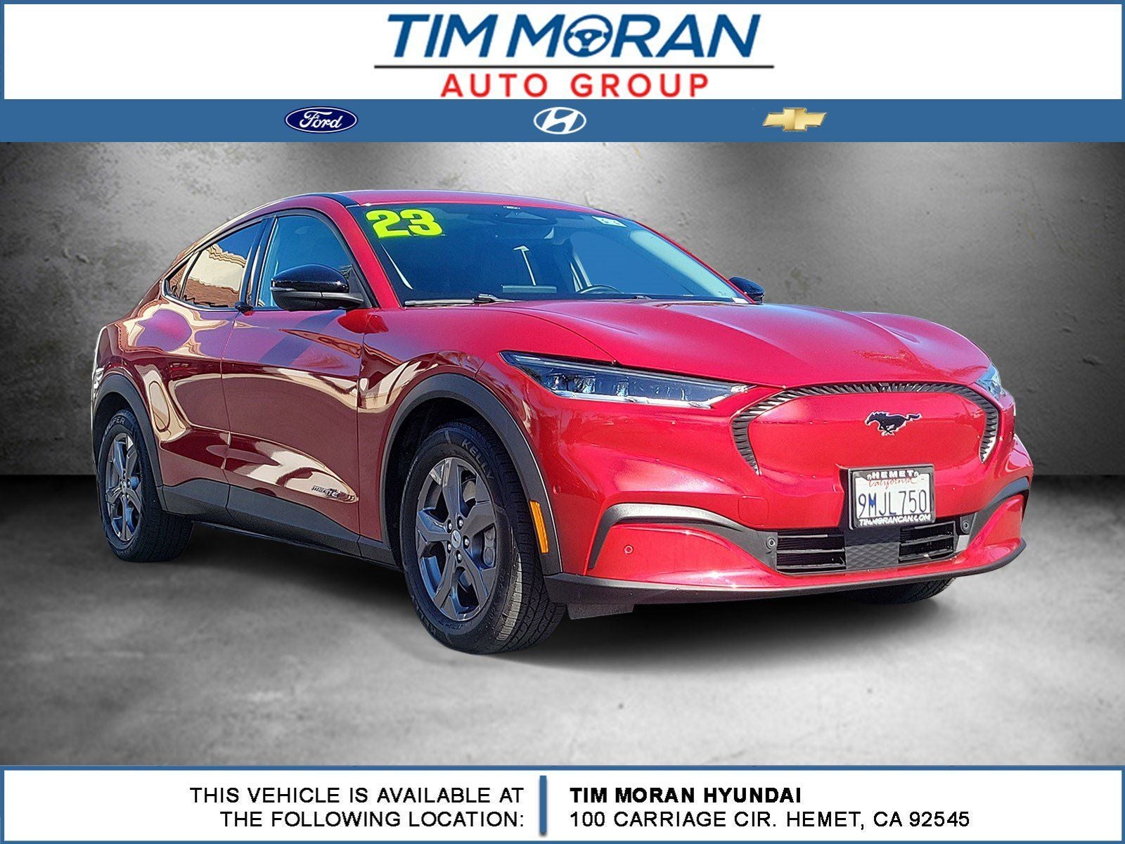 2023 Ford Mustang Mach-E Select in Rapid Red Metallic Tinted Clearcoat — front three-quarter view