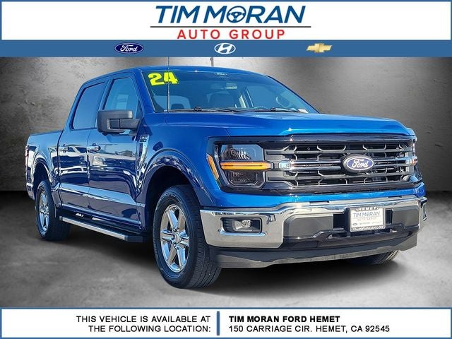 2024 Ford F-150 XLT in Atlas Blue Metallic — front three-quarter view