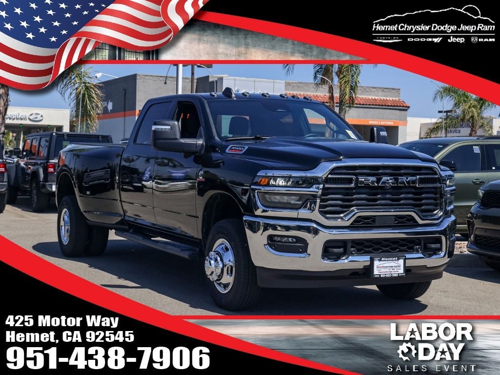 2026 RAM 3500 Tradesman in Diamond Black Crystal Pearlcoat — front three-quarter view